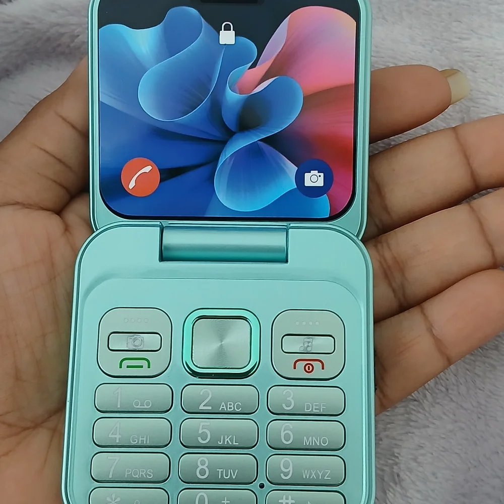 Compact Teal Digital Camera with Quad Lens